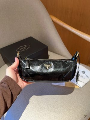 Prada women's Re-Edition 2002 waxed leather baguette underarm bag - Image 2